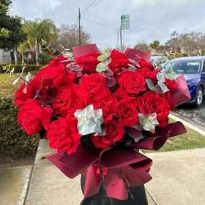 Classic luxury red rose bouquet with burgundy wrapping paper