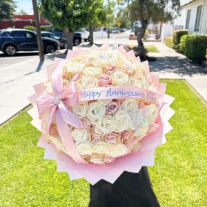 Blushing Romance 100 rose bouquet with ribbon message