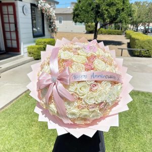 Blushing Romance 100 rose bouquet with ribbon message